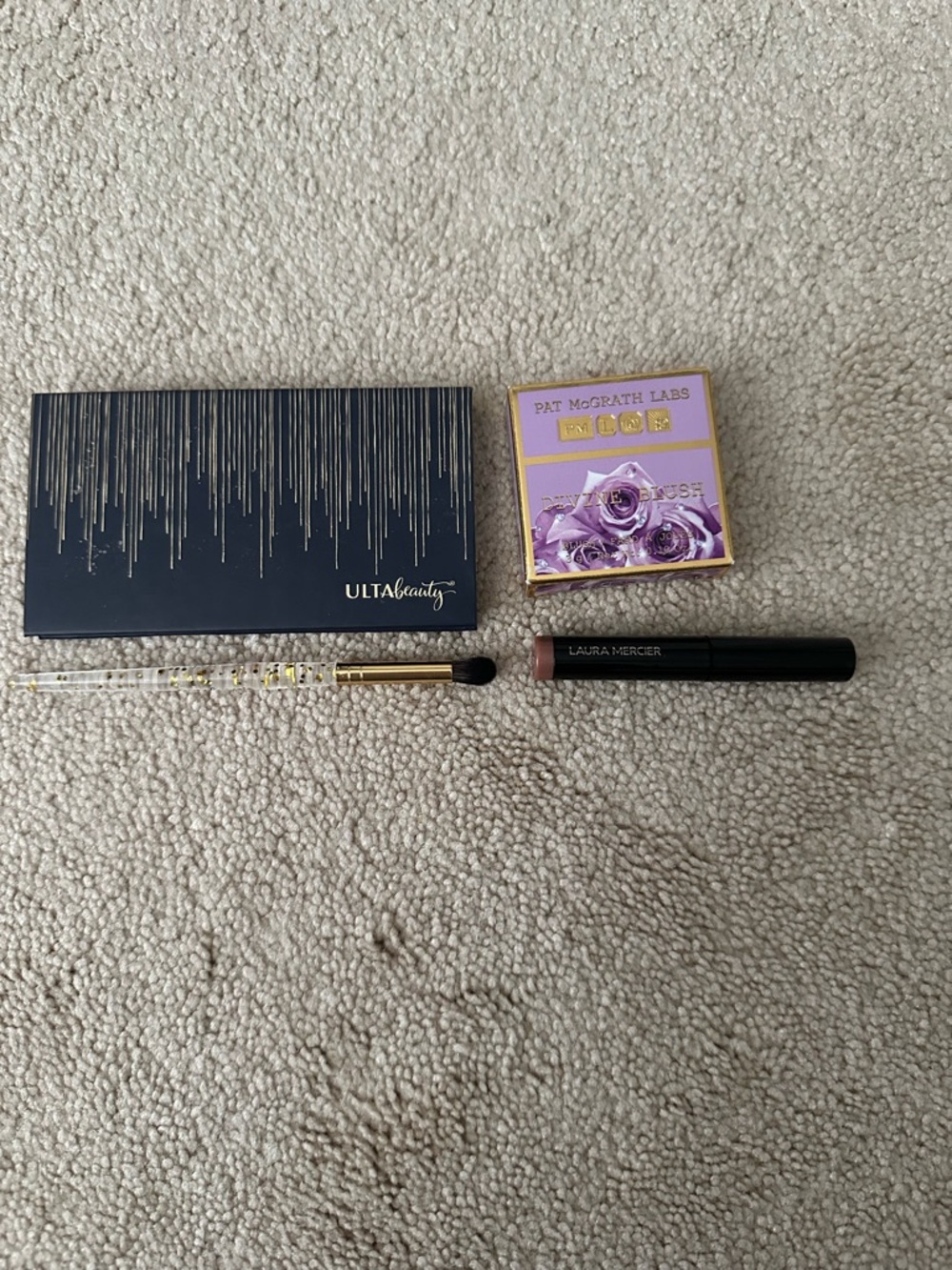 Ulta beauty eye pallet, Laura Mercier eye stick, and Pat McGrath Blush and bag